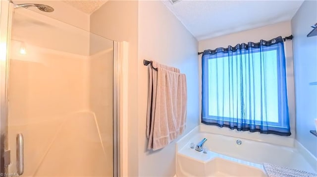 1721 Abbottsford Dr, Kernersville, NC 27284 - full bath featuring a garden tub, a shower stall, and a textured ceiling