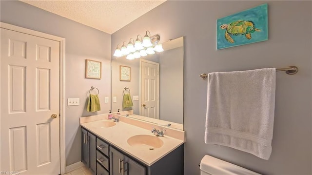 1721 Abbottsford Dr, Kernersville, NC 27284 - full bathroom featuring double vanity, a textured ceiling, and tile patterned floors
