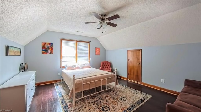1721 Abbottsford Dr, Kernersville, NC 27284 - bedroom with a textured ceiling, lofted ceiling, dark wood-style flooring, and ceiling fan