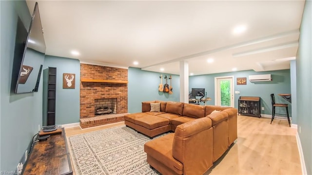 1721 Abbottsford Dr, Kernersville, NC 27284 - living room with a wall mounted AC, light wood-type flooring, a fireplace, and recessed lighting