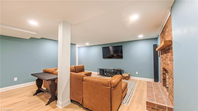1721 Abbottsford Dr, Kernersville, NC 27284 - living area with light wood finished floors, a brick fireplace, and recessed lighting