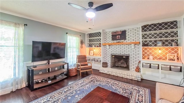 1721 Abbottsford Dr, Kernersville, NC 27284 - living area featuring crown molding, a ceiling fan, wood finished floors, a fireplace, and a textured ceiling