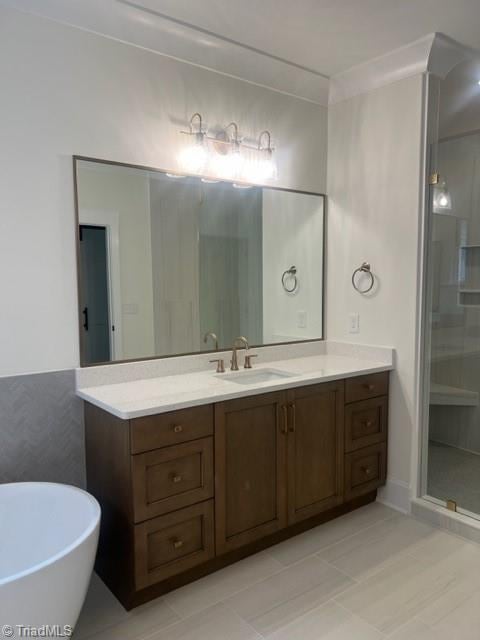 bathroom featuring tile patterned flooring, vanity, and separate shower and tub