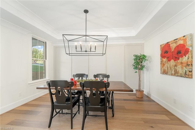 dining room featuring an inviting chandelier and light wood-type flooring