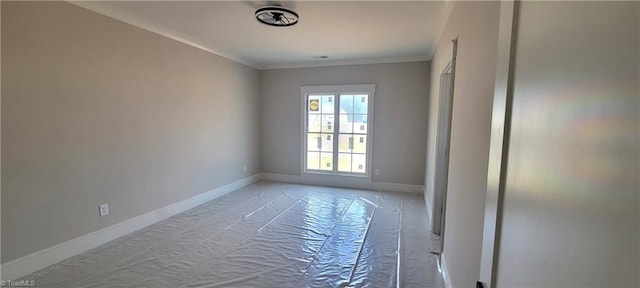 spare room with crown molding