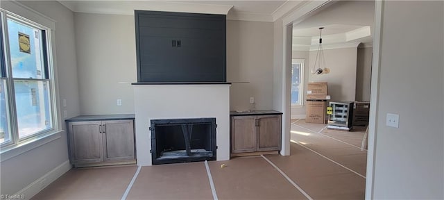 unfurnished living room with ornamental molding