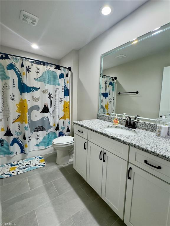 2968 Tobaccoville Rd, Tobaccoville, NC 27050 - full bathroom featuring vanity, visible vents, recessed lighting, toilet, and a shower with shower curtain