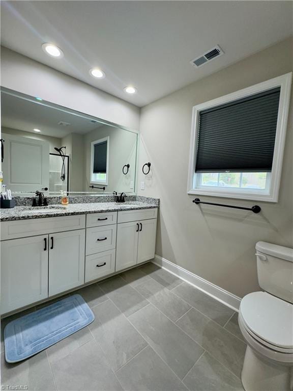 2968 Tobaccoville Rd, Tobaccoville, NC 27050 - bathroom featuring a sink, visible vents, toilet, and baseboards