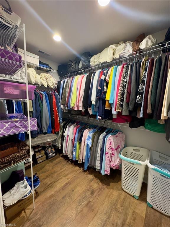 2968 Tobaccoville Rd, Tobaccoville, NC 27050 - walk in closet featuring visible vents and wood finished floors