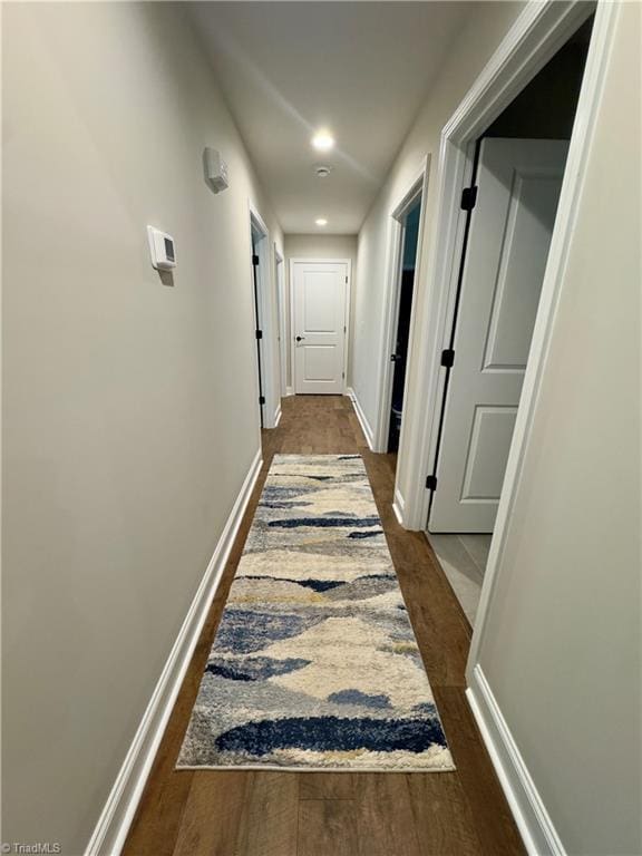 2968 Tobaccoville Rd, Tobaccoville, NC 27050 - corridor featuring dark wood-type flooring and baseboards