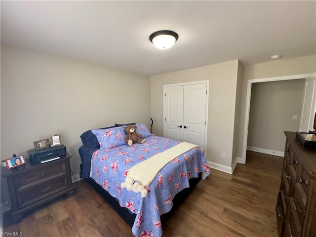 2968 Tobaccoville Rd, Tobaccoville, NC 27050 - bedroom featuring a closet, baseboards, and wood finished floors