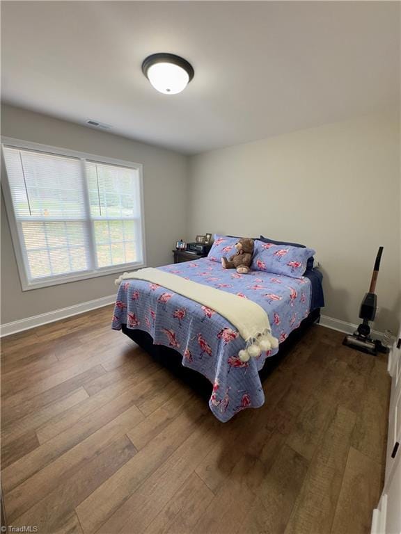 2968 Tobaccoville Rd, Tobaccoville, NC 27050 - bedroom featuring visible vents, baseboards, and wood finished floors