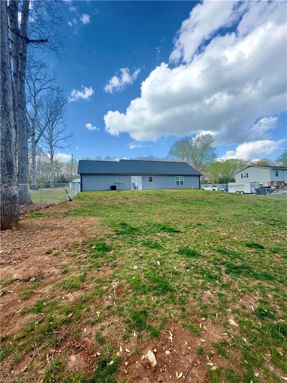 2968 Tobaccoville Rd, Tobaccoville, NC 27050 - rear view of property with fence