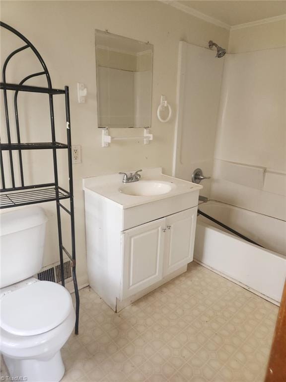 bathroom featuring vanity, tub / shower combination, crown molding, toilet, and tile patterned floors