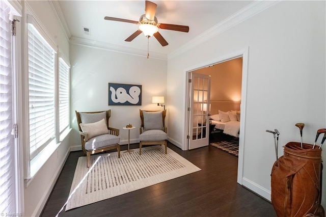 sitting room with ceiling fan, french doors, dark hardwood / wood-style floors, and ornamental molding