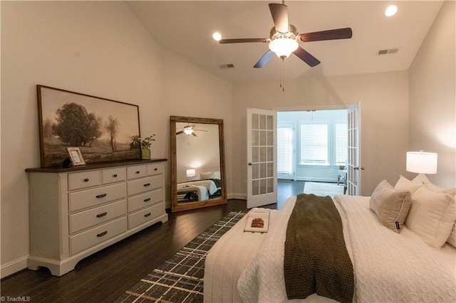 bedroom with ceiling fan, french doors, dark hardwood / wood-style floors, and vaulted ceiling