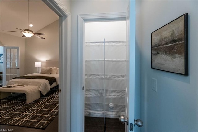 bedroom featuring ceiling fan and lofted ceiling