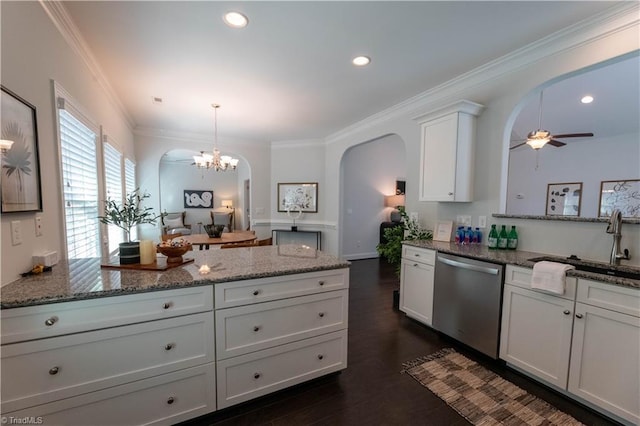 kitchen featuring white cabinetry, dishwasher, light stone countertops, pendant lighting, and ceiling fan with notable chandelier