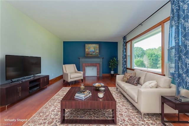 living room featuring hardwood / wood-style floors and a fireplace