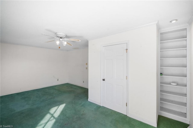 unfurnished bedroom featuring ceiling fan and dark colored carpet