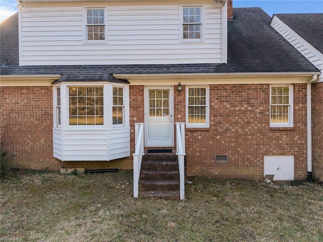 back of house featuring a yard