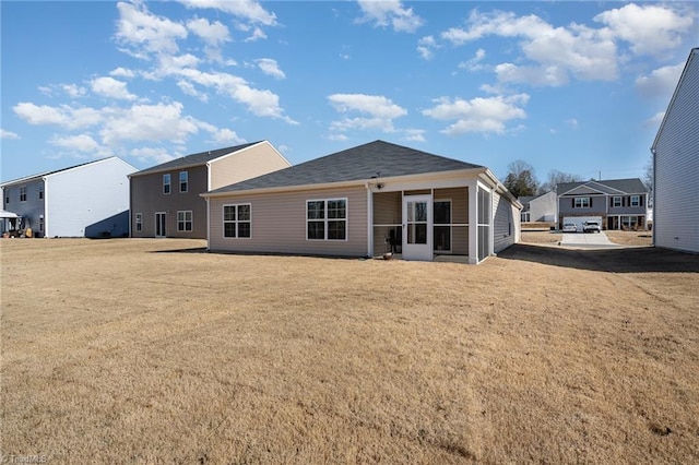 4997 Payne St, Trinity, NC 27370 - back of property with a lawn and a sunroom
