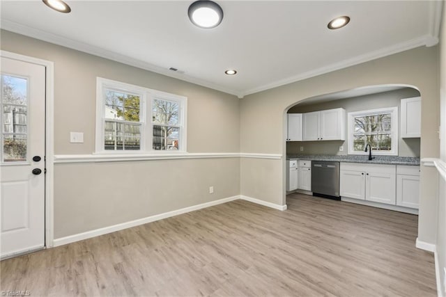 kitchen with white cabinetry, sink, crown molding, and dishwasher