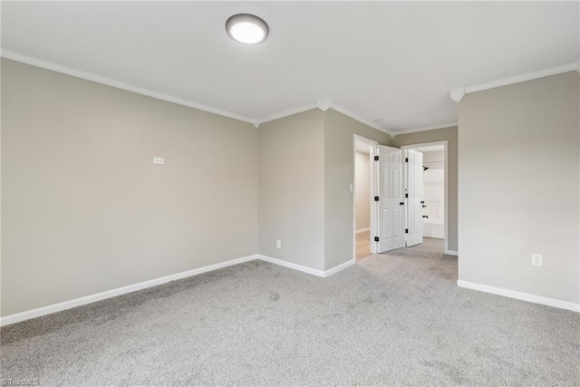 carpeted spare room with ornamental molding