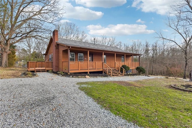 log-style house featuring a front yard