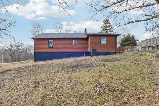 view of property exterior featuring a yard and central air condition unit