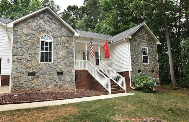 single story home with a porch, a shingled roof, crawl space, a front lawn, and stairs