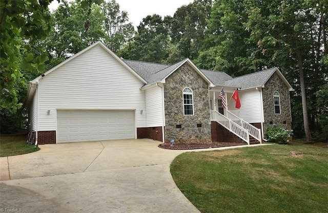 ranch-style home featuring crawl space, stone siding, driveway, and a front yard