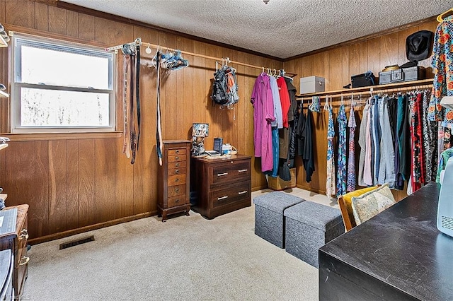 walk in closet with visible vents and carpet flooring