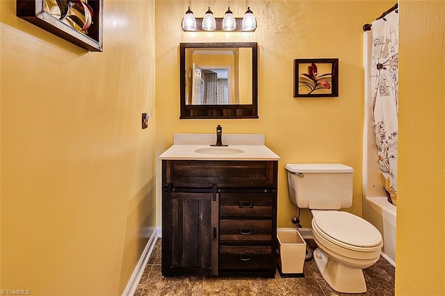 bathroom featuring toilet, baseboards, shower / bath combination with curtain, and vanity