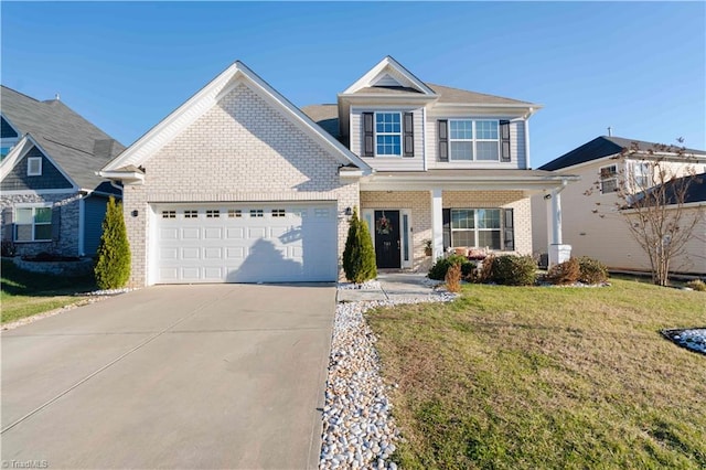 view of front of house featuring a garage and a front lawn