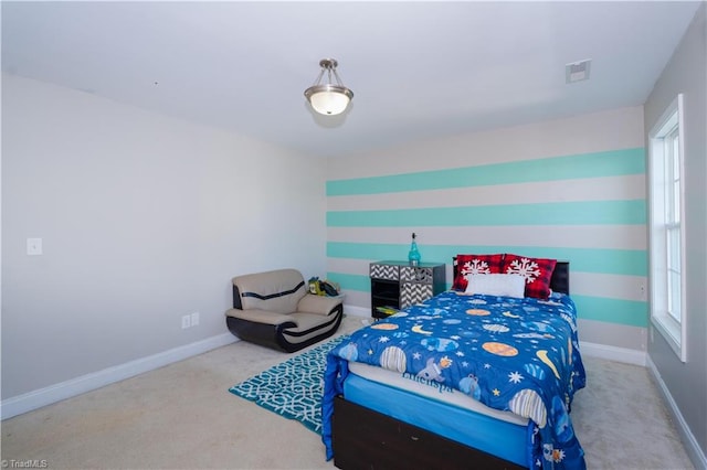 carpeted bedroom featuring multiple windows