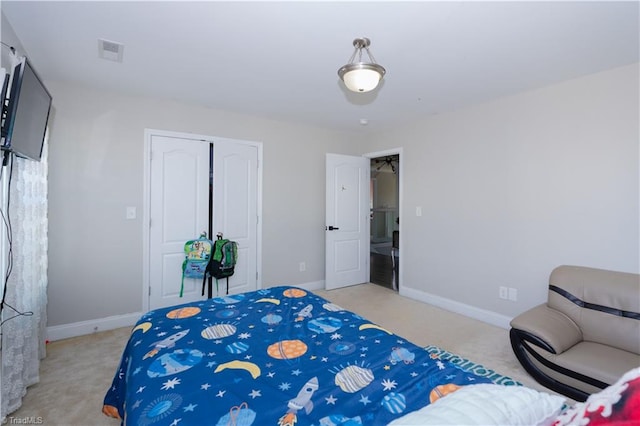 carpeted bedroom featuring a closet