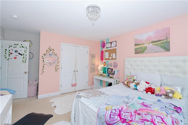 bedroom with light colored carpet and a closet