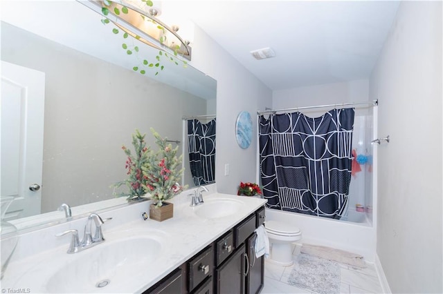 full bathroom featuring shower / bath combo, vanity, and toilet