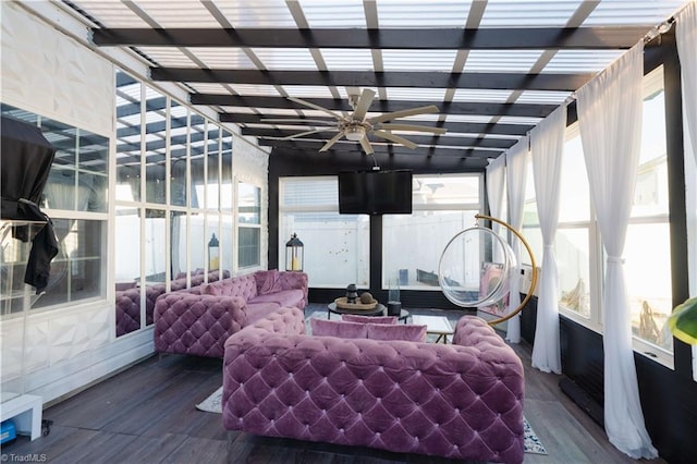 sunroom / solarium featuring ceiling fan