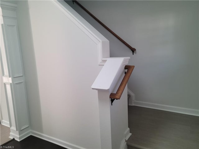 stairs with wood-type flooring