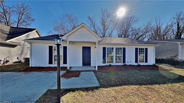 ranch-style home with central air condition unit