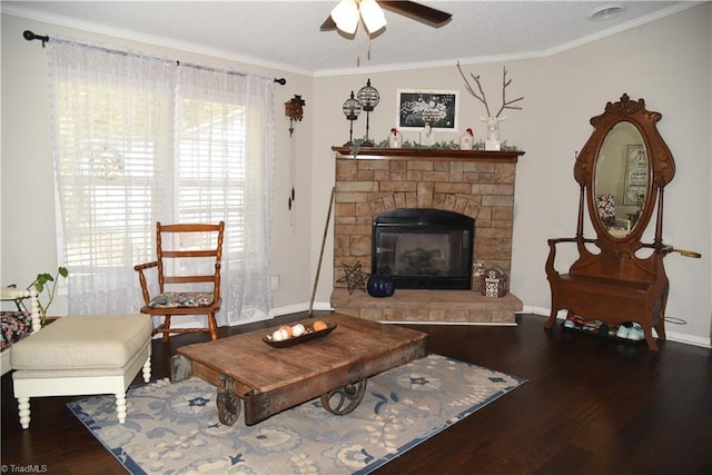 621 Southern Rd, King, NC 27021 - living area featuring wood finished floors, ceiling fan, a stone fireplace, and crown molding