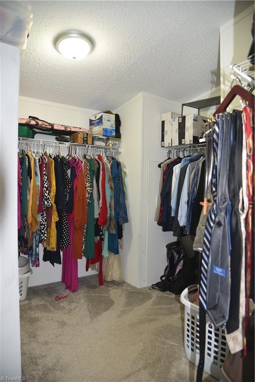621 Southern Rd, King, NC 27021 - spacious closet with carpet floors