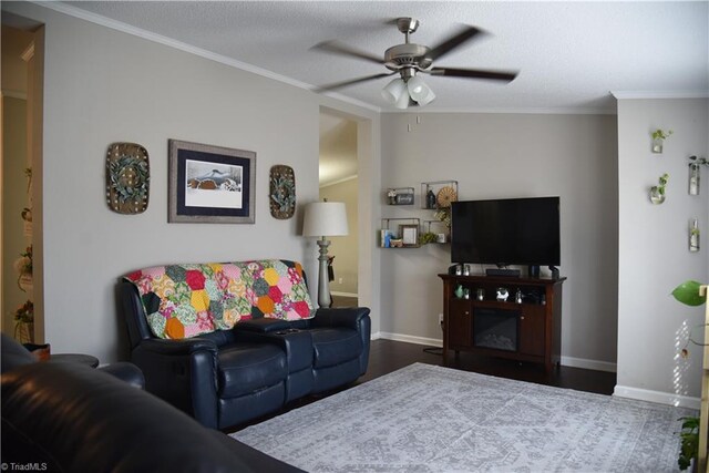 621 Southern Rd, King, NC 27021 - living room featuring ceiling fan, ornamental molding, and wood finished floors