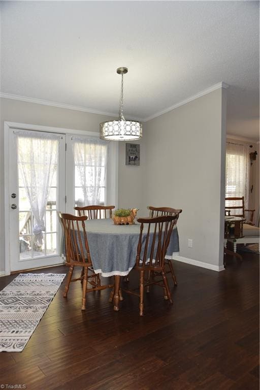 621 Southern Rd, King, NC 27021 - dining space with crown molding, a chandelier, and wood finished floors