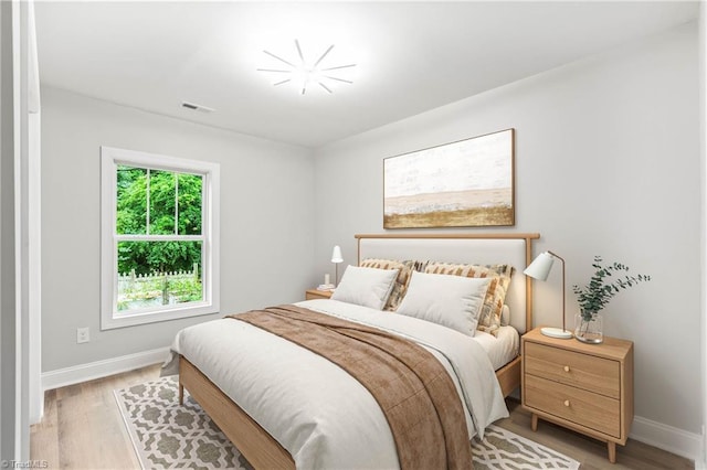 1732 Harrison Ave, Winston-Salem, NC 27105 - bedroom with baseboards and light wood finished floors