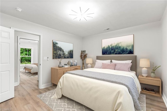 1732 Harrison Ave, Winston-Salem, NC 27105 - bedroom featuring light wood finished floors and baseboards