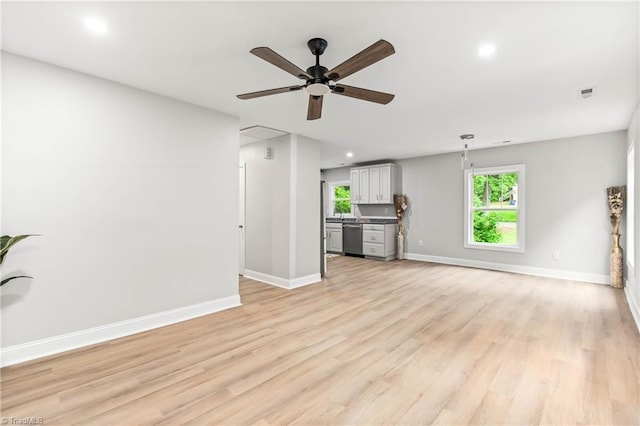 1732 Harrison Ave, Winston-Salem, NC 27105 - unfurnished living room with a ceiling fan, light wood-style flooring, healthy amount of natural light, and recessed lighting