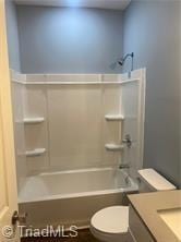 full bath with vanity, toilet, and shower / bath combination